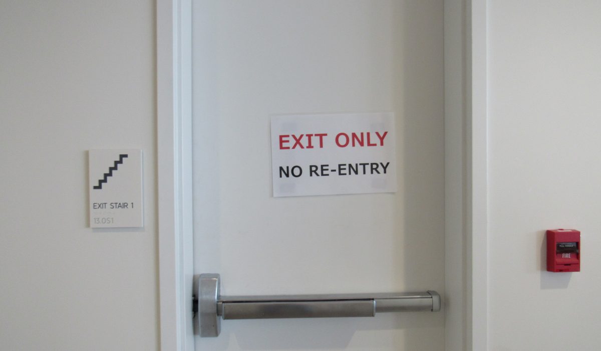 Emergency evacuation door with sign that says "exit only no re-entry"
