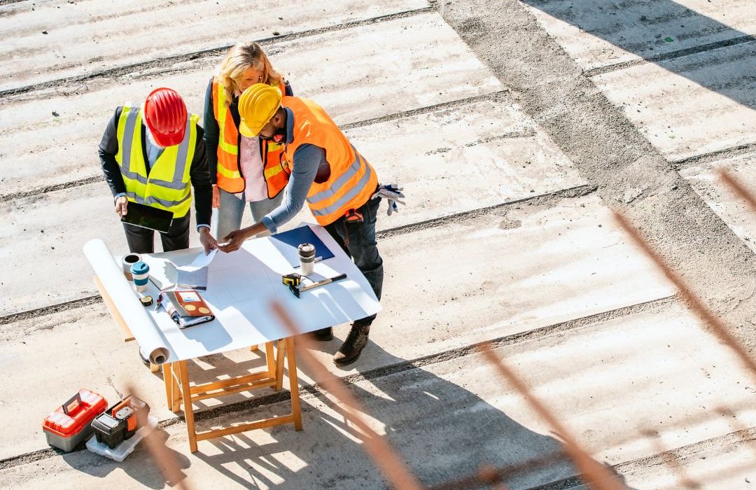 People reviewing an emergency plan on a construction site